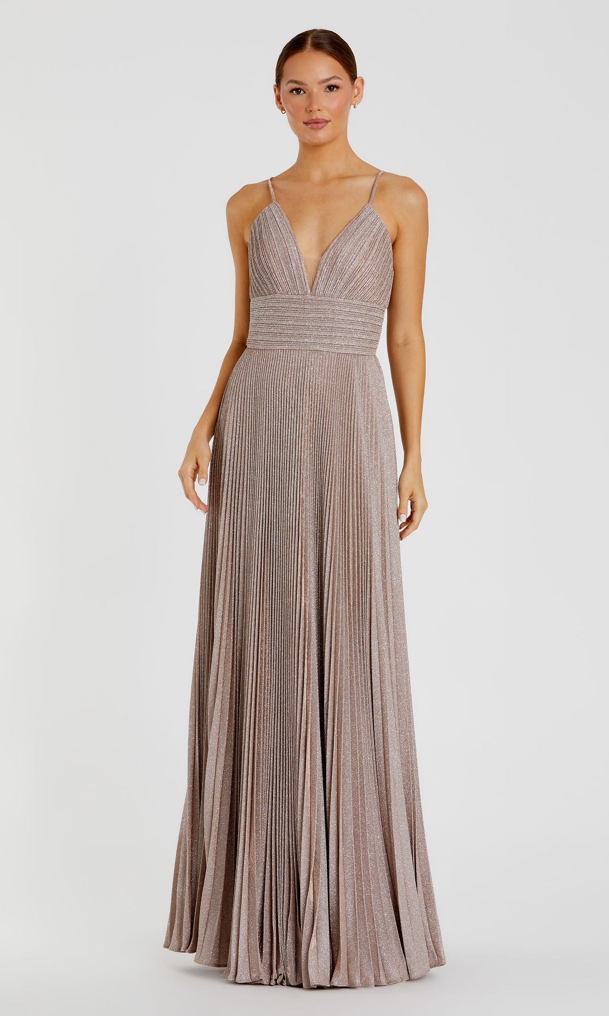 A woman wears the Pleated Empire-Waist Long A-Line Prom Dress 30725, a floor-length, sleeveless gown with thin straps and a deep V-neckline, standing against a plain white background.